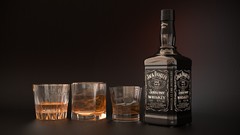 Alcohol bottles whiskey jack daniels liquor brown background