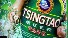 Alcohol green background beers Tsingtao