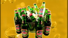Alcohol yellow background bottles beers Tsingtao