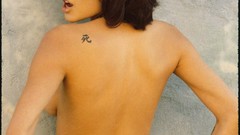 Angelina Jolie topless tattoos