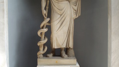 Asclepius statue high architecture