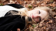 Autumn woman blondes blue eyes lying down