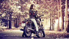 Autumn woman motorbikes middle finger