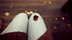 Autumn woman sitting legs