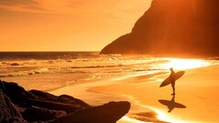 beach surfers sunlight Sea rock surfboards standing alone