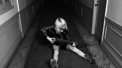 Black and white acoustic guitars