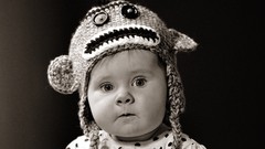 Black and white baby hats faces
