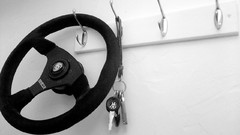 Black and white cars keys steering wheel
