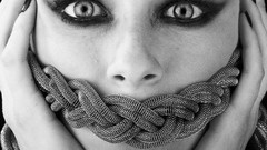 Black and white eyes faces gagged