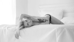 Black and white woman beds tattoos panties