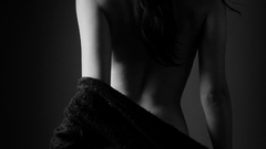 Black and white woman jeans back view