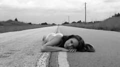 Black and white woman roads lying down