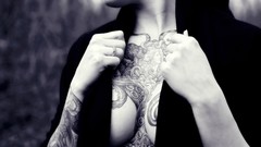 Black and white woman tattoos cleavage boobs