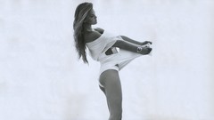 Black and white woman white background bracelets long hair 