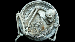 Black background sculptures skeletons