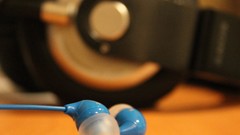 Black blue headphones brown desks