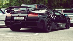 Black cars Lamborghini parking outdoors sunlight streets 