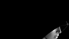 Black faces black background