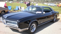 Black left 1966 Buick Riviera