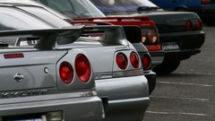 Black red silver cars close-up Nissan parking Range vehicles 