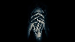 Black wall dark eyes woman hands horror creepy