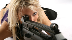 Blonde aiming hk laying