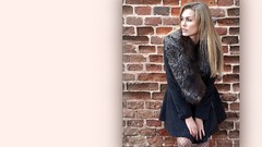 Blondes woman brick wall