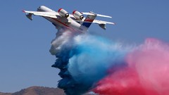 Blue Aircraft red white smoke skyscapes
