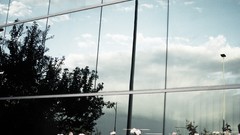 Blue clouds white windows reflections