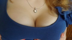 Blue woman close-up chains blondes cleavage holding boobs