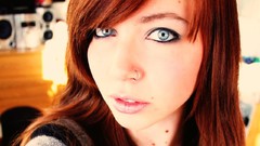 Blue woman faces redheads