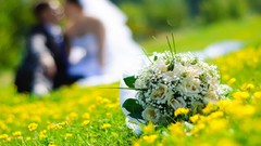 Bouquet couple marriage yellow flowers blurred background depth 