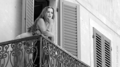 Brunettes woman models balcony