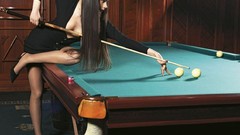 Brunettes woman models billiards