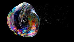 Bubbles liquid black background water drops burst rainbows 