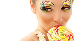 Candies licking lollipops
