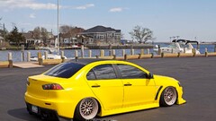 Car yellow cars Mitsubishi Lancer Evo X Harbor Mitsubishi boat