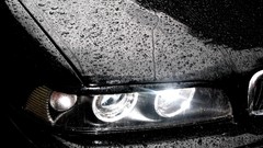 Cars close-up BMW water drops headlights black cars