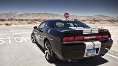 Cars dodge challenger stop signs