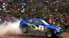 Cars jumping dust rally