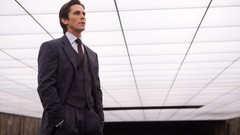 Ceiling tie suit Christian Bale bruce wayne hands in pockets 