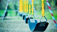 Chains playground swings blurred background