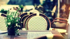 Chairs Tables white flowers bokeh outdoors blurred background 