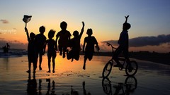 Children jumping arms raised