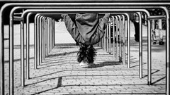 Children railing hanging shadows streets upside down playground 