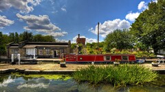 cityscape City building boat Plants clouds Trees canal