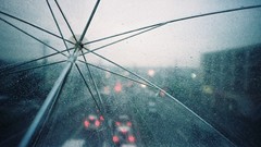 Cityscapes rain traffic Umbrellas