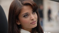 Close-up Aishwarya Rai faces earrings long hair blue eyes 