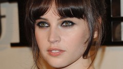 Close-up faces green eyes brunettes models black dress standing 