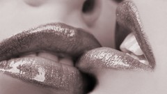 Close-up lips kissing lesbians
